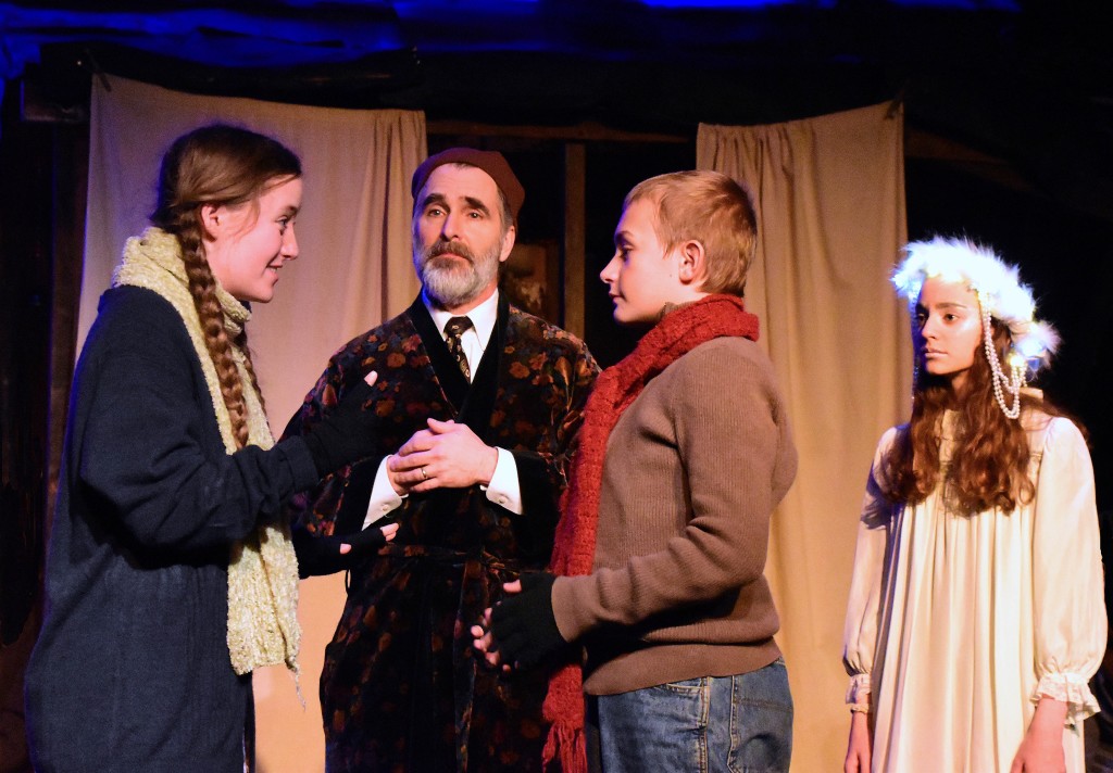 Evelyn Izdepski as Fan tells Shawn Hubbard as Young Ebenezer that he can come home, as David Whitehead (Scooge) and Talia Cutler (Ghost of Christmas Past) look on.  Photo by Chip Gertzog.