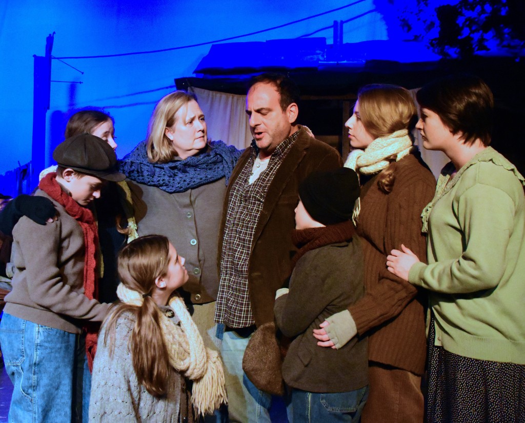 Laura Champe Mitchell and Nick Manicone as Mr. and Mrs. Belle with family, Evelyn Izdepski, Shawn Hubbard, Erika Friel, Caden Mitchell, Chloe Sinder and Sarah Lemon.